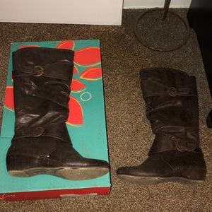 women’s tall dark brown boots with gold buckles